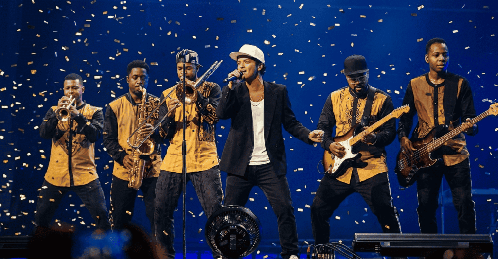 Bruno Mars tour live performance with stage lights and crowd